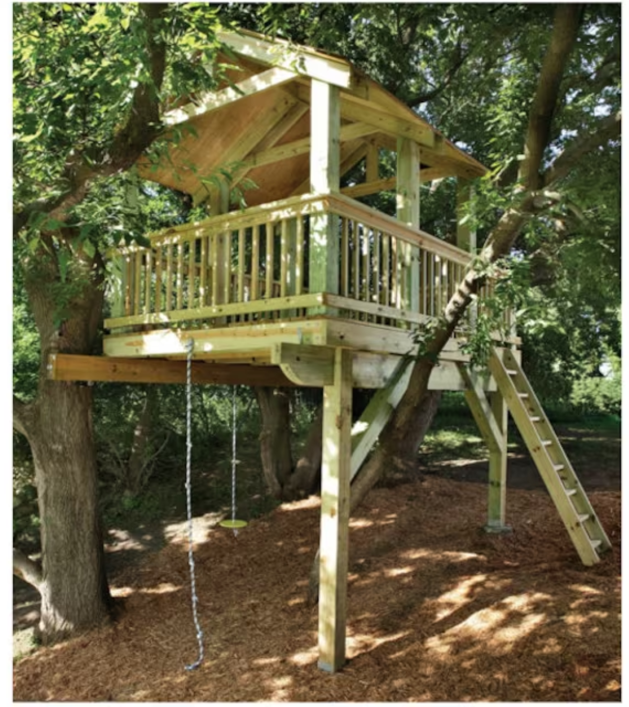 Wooden treehouse with ladder and swings in a shaded backyard
